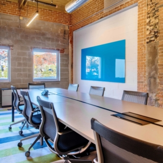 blue Float wall-mounted glass board in conference room